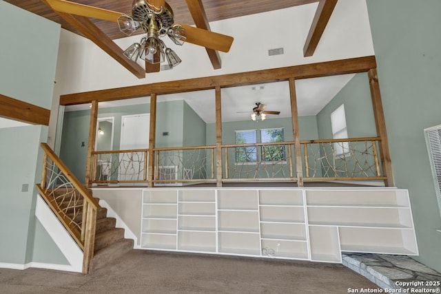642 Lakebreeze, Canyon Lake, TX 78133 - interior space with ceiling fan, high vaulted ceiling, beamed ceiling, carpet, and stairway