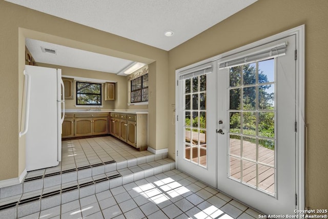 642 Lakebreeze, Canyon Lake, TX 78133 - doorway with light tile patterned floors and french doors