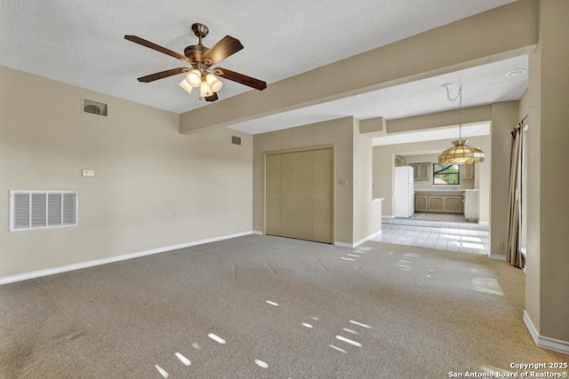 642 Lakebreeze, Canyon Lake, TX 78133 - carpeted spare room with a textured ceiling and a ceiling fan