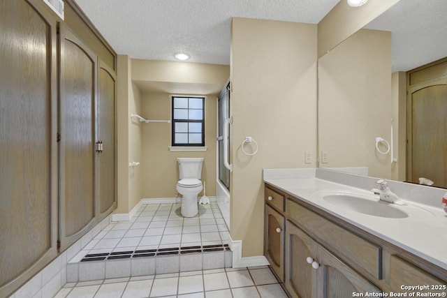 642 Lakebreeze, Canyon Lake, TX 78133 - full bathroom with tile patterned floors, vanity, a textured ceiling, and combined bath / shower with glass door