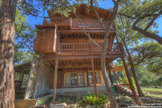 642 Lakebreeze, Canyon Lake, TX 78133 - rear view of property with a balcony and stairs