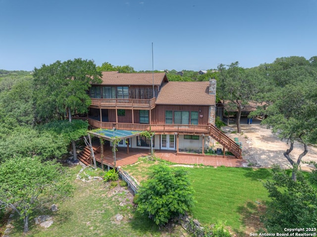 642 Lakebreeze, Canyon Lake, TX 78133 - rear view of property featuring stairs, a chimney, a deck, and french doors