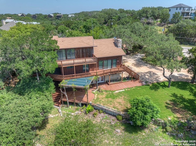 642 Lakebreeze, Canyon Lake, TX 78133 - back of house featuring stairs, a wooden deck, and a chimney