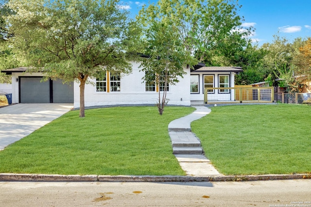 207 Northaven, San Antonio, TX 78229 - view of front facade featuring driveway and a garage