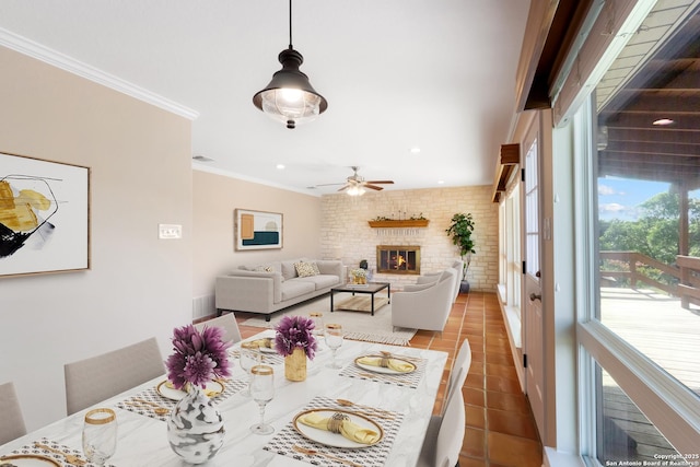 890 Live Oak, Spring Branch, TX 78070 - dining space with crown molding, tile patterned floors, ceiling fan, a brick fireplace, and recessed lighting