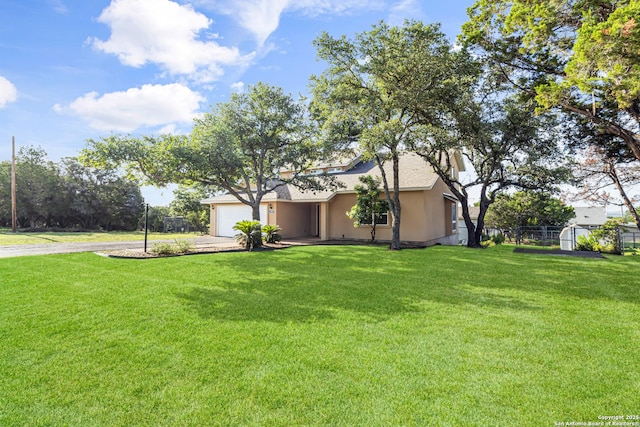 890 Live Oak, Spring Branch, TX 78070 - view of home's exterior with stucco siding, driveway, an attached garage, and roof with shingles