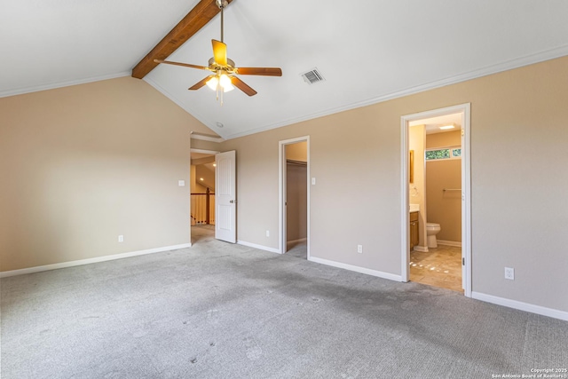 890 Live Oak, Spring Branch, TX 78070 - unfurnished bedroom with carpet floors, a walk in closet, baseboards, ensuite bathroom, and a ceiling fan
