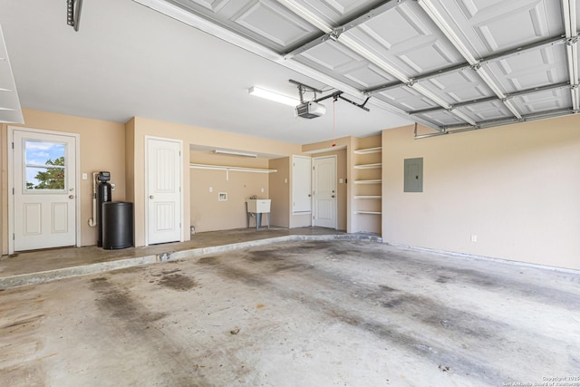 890 Live Oak, Spring Branch, TX 78070 - garage featuring a garage door opener and electric panel