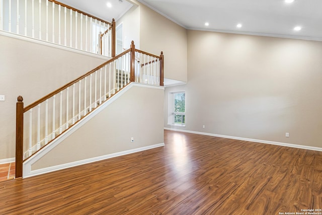 890 Live Oak, Spring Branch, TX 78070 - unfurnished living room featuring crown molding, wood finished floors, recessed lighting, stairs, and baseboards