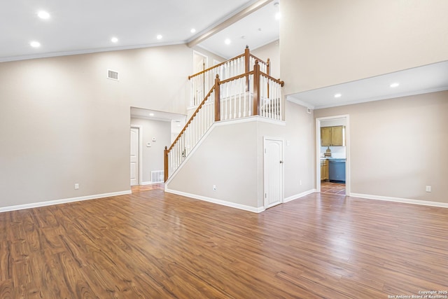 890 Live Oak, Spring Branch, TX 78070 - unfurnished living room featuring stairs, high vaulted ceiling, baseboards, wood finished floors, and recessed lighting