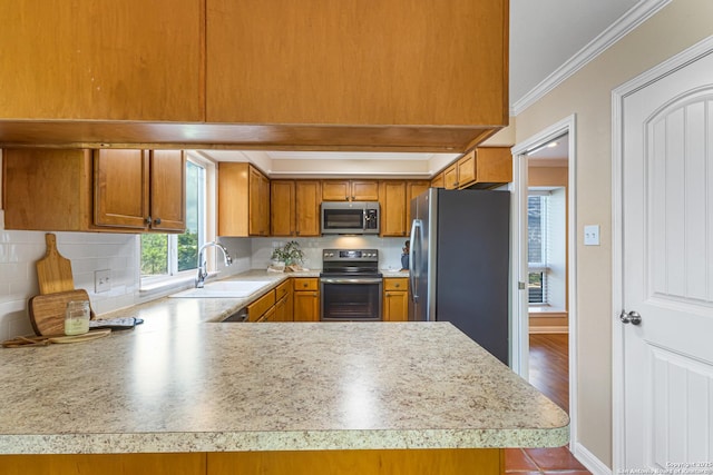 890 Live Oak, Spring Branch, TX 78070 - kitchen with appliances with stainless steel finishes, a sink, ornamental molding, light countertops, and brown cabinetry