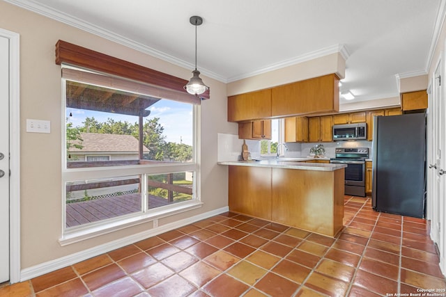 890 Live Oak, Spring Branch, TX 78070 - kitchen with appliances with stainless steel finishes, brown cabinetry, a peninsula, tile patterned flooring, and ornamental molding