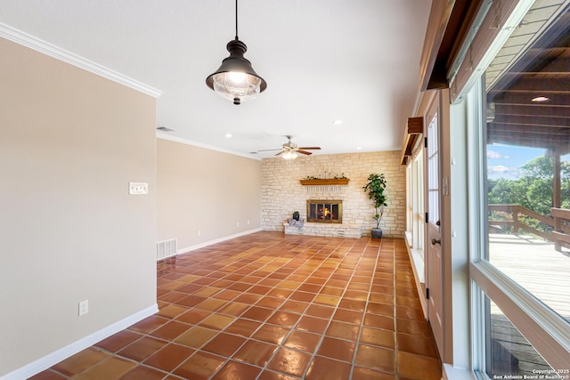 890 Live Oak, Spring Branch, TX 78070 - unfurnished living room featuring baseboards, crown molding, a ceiling fan, dark tile patterned floors, and a brick fireplace