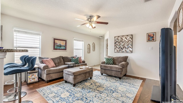3714 Hideaway Grn, San Antonio, TX 78261 - living room featuring ceiling fan, wood finished floors, and a textured ceiling