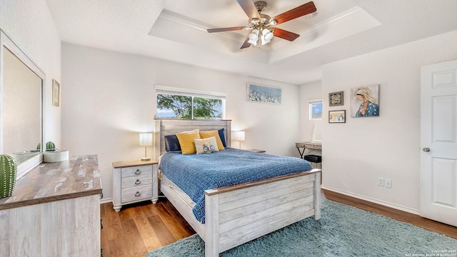 3714 Hideaway Grn, San Antonio, TX 78261 - bedroom with a tray ceiling, wood finished floors, baseboards, a ceiling fan, and ornamental molding
