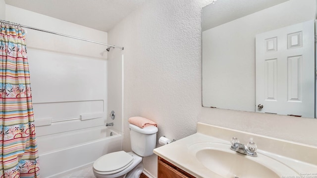 3714 Hideaway Grn, San Antonio, TX 78261 - bathroom featuring a textured wall, toilet, vanity, and shower / bath combination with curtain