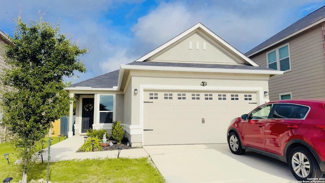 1919 Overlook Knl, San Antonio, TX 78245 - view of front of property with stucco siding, concrete driveway, an attached garage, and a shingled roof