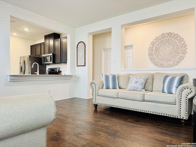 1919 Overlook Knl, San Antonio, TX 78245 - living area with dark wood-style floors, baseboards, and recessed lighting