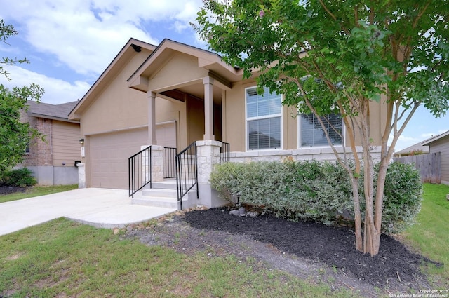810 Brown Thrasher, San Antonio, TX 78253 - view of front of house featuring stucco siding, a garage, and driveway