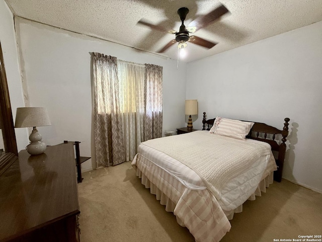 9010 Bowline, San Antonio, TX 78242 - bedroom with light carpet, a ceiling fan, and a textured ceiling