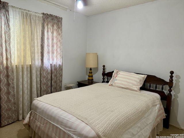 9010 Bowline, San Antonio, TX 78242 - bedroom featuring light carpet and a textured ceiling