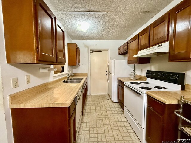 9010 Bowline, San Antonio, TX 78242 - kitchen with white appliances, under cabinet range hood, a sink, and brick patterned flooring