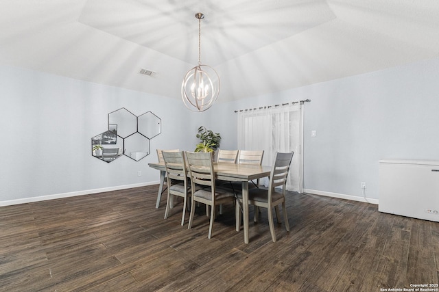 13040 Tomlynn, Atascosa, TX 78002 - dining area featuring vaulted ceiling, a chandelier, wood finished floors, and baseboards