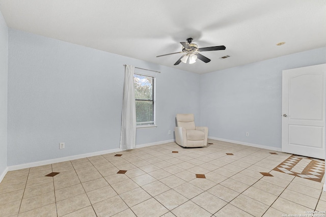 13040 Tomlynn, Atascosa, TX 78002 - unfurnished room with ceiling fan, light tile patterned flooring, and baseboards