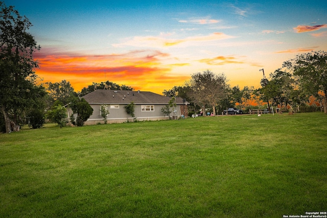 13040 Tomlynn, Atascosa, TX 78002 - yard at dusk with a lawn