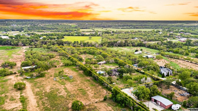 13040 Tomlynn, Atascosa, TX 78002 - aerial view at dusk of property parcel outlined and a view of countryside