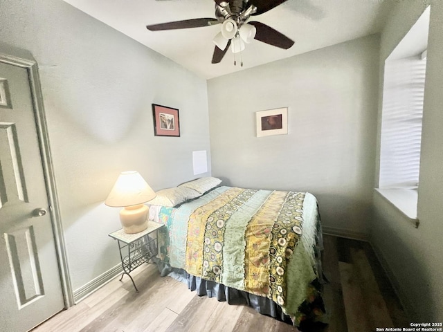 415 Fort Clark Rd Unit 21, Brackettville, TX 78832 - bedroom with wood finished floors, ceiling fan, and baseboards