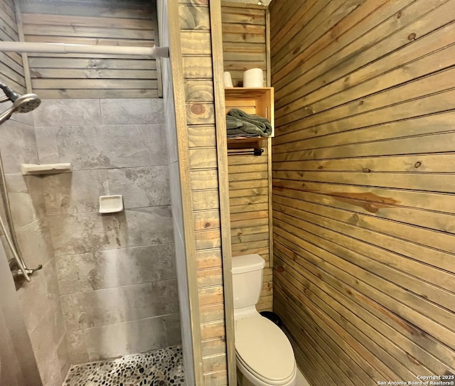 415 Fort Clark Rd Unit 21, Brackettville, TX 78832 - full bath with a shower stall, toilet, and wooden walls