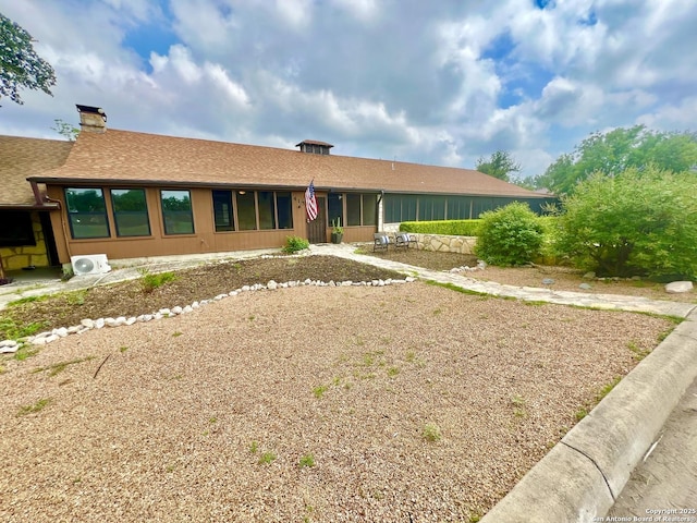 415 Fort Clark Rd Unit 21, Brackettville, TX 78832 - ranch-style house with roof with shingles, ac unit, and a chimney