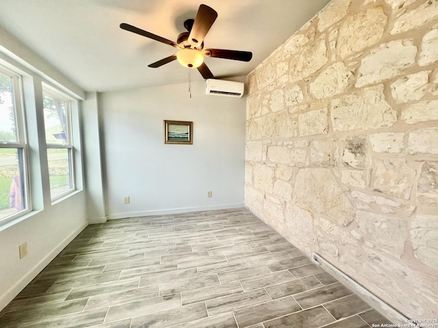 415 Fort Clark Rd Unit 21, Brackettville, TX 78832 - spare room with a wall mounted AC, a ceiling fan, and wood finished floors