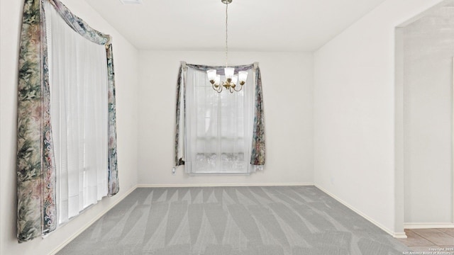 4501 Madrone, Schertz, TX 78154 - empty room featuring a chandelier, carpet floors, and baseboards