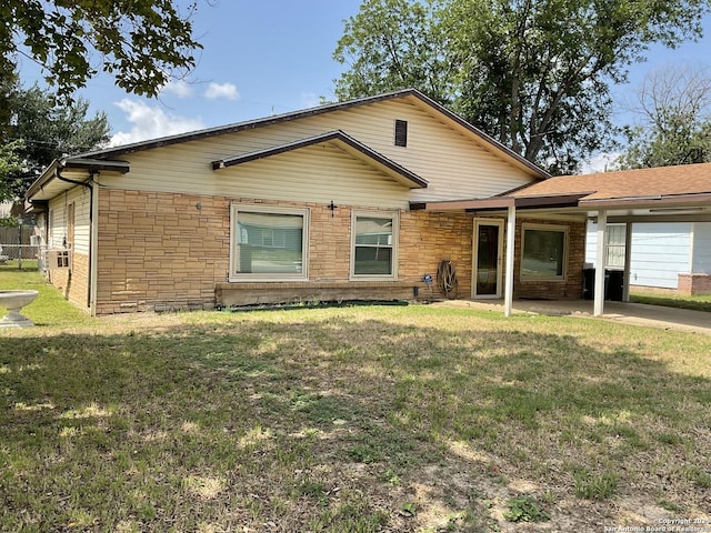 2918 Hatton, San Antonio, TX 78237 - single story home featuring a front lawn, a carport, a patio, and stone siding