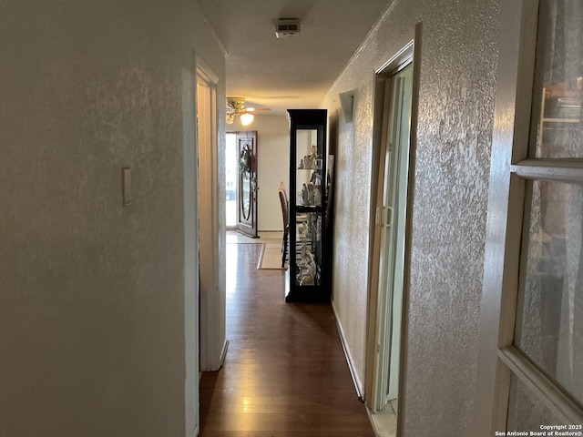 2918 Hatton, San Antonio, TX 78237 - hallway featuring a textured wall and wood finished floors