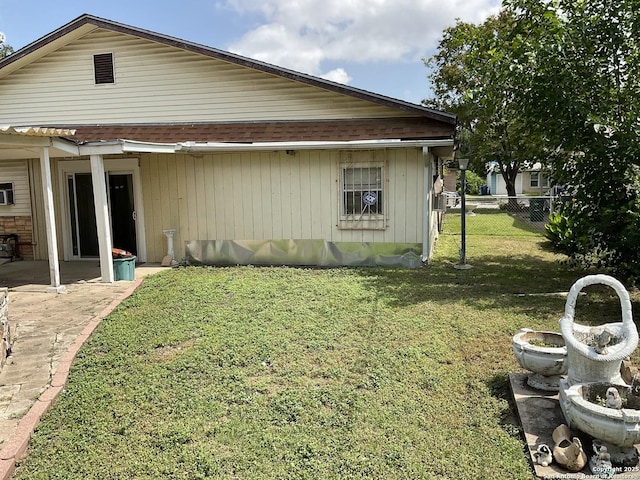 2918 Hatton, San Antonio, TX 78237 - view of side of home featuring a patio and roof with shingles