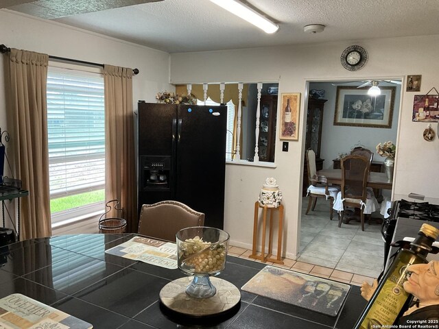 2918 Hatton, San Antonio, TX 78237 - dining space with a textured ceiling and tile patterned flooring