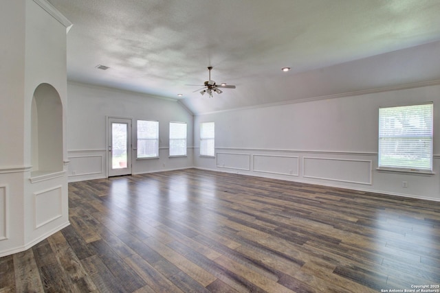 27123 Trinity Woods, San Antonio, TX 78261 - unfurnished room with ceiling fan, a decorative wall, lofted ceiling, dark wood-type flooring, and wainscoting