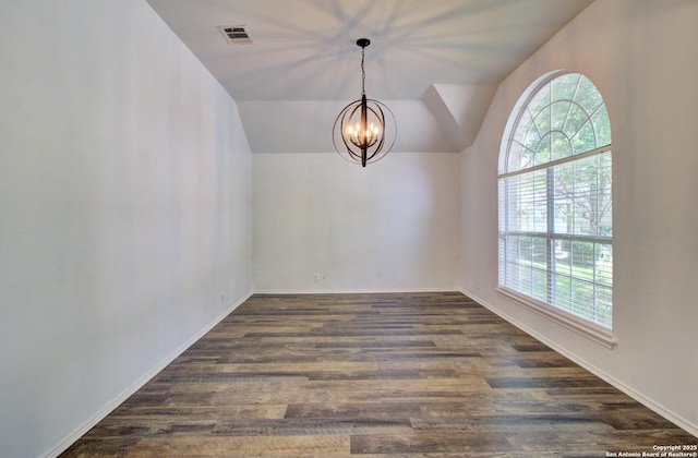 27123 Trinity Woods, San Antonio, TX 78261 - spare room featuring healthy amount of natural light, a chandelier, dark wood-style floors, vaulted ceiling, and baseboards