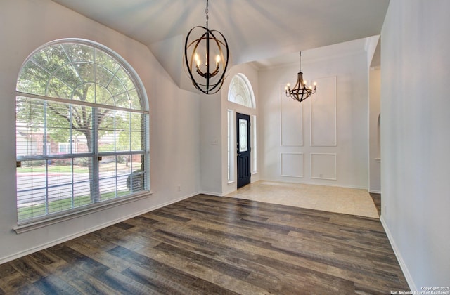 27123 Trinity Woods, San Antonio, TX 78261 - foyer entrance with a chandelier, plenty of natural light, wood finished floors, baseboards, and lofted ceiling