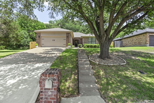 3105 Pecan Valley Dr, Temple, TX 76502 - view of front of house featuring brick siding, an attached garage, concrete driveway, and a front lawn