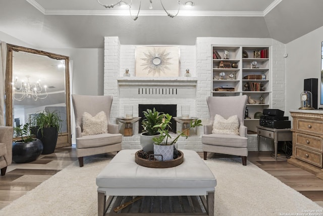 3105 Pecan Valley Dr, Temple, TX 76502 - living room featuring a chandelier, wood finished floors, ornamental molding, a fireplace, and lofted ceiling