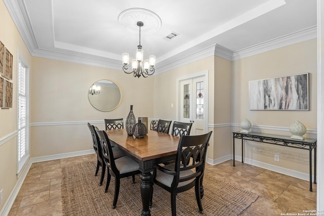 18203 Newcliff, San Antonio, TX 78259 - dining space featuring a chandelier, a raised ceiling, stone finish flooring, baseboards, and ornamental molding