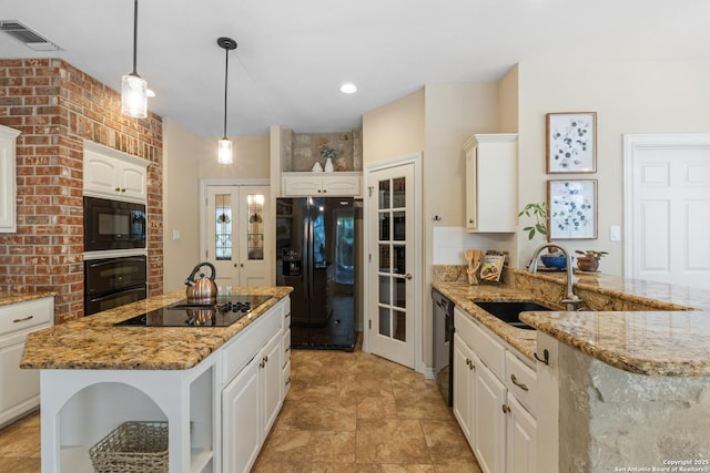18203 Newcliff, San Antonio, TX 78259 - kitchen with black appliances, a sink, white cabinets, and light stone countertops