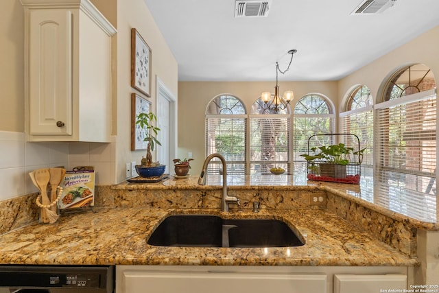 18203 Newcliff, San Antonio, TX 78259 - kitchen featuring a sink, dishwasher, light stone counters, and a chandelier