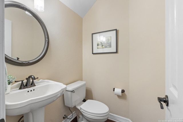 18203 Newcliff, San Antonio, TX 78259 - half bathroom with toilet, a sink, lofted ceiling, and baseboards