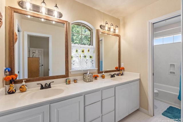 18203 Newcliff, San Antonio, TX 78259 - full bathroom with double vanity, toilet, and tile patterned floors