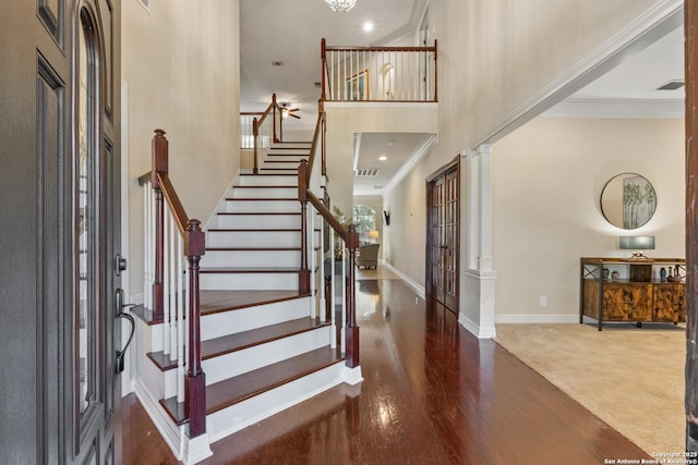 18203 Newcliff, San Antonio, TX 78259 - entryway with crown molding, stairway, baseboards, wood finished floors, and a high ceiling